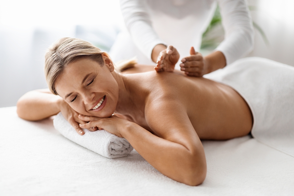 Beautiful,Middle,Aged,Woman,Enjoying,Professional,Wellness,Massage,In,Spa