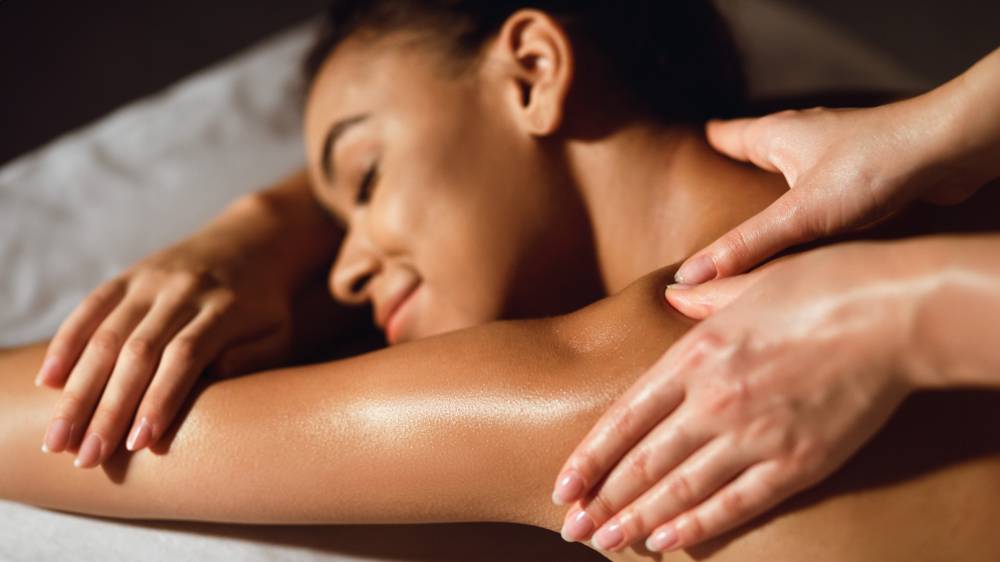 Woman receiving traditional shoulder massage at Venice spa